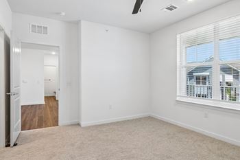 Empty bedroom with large window